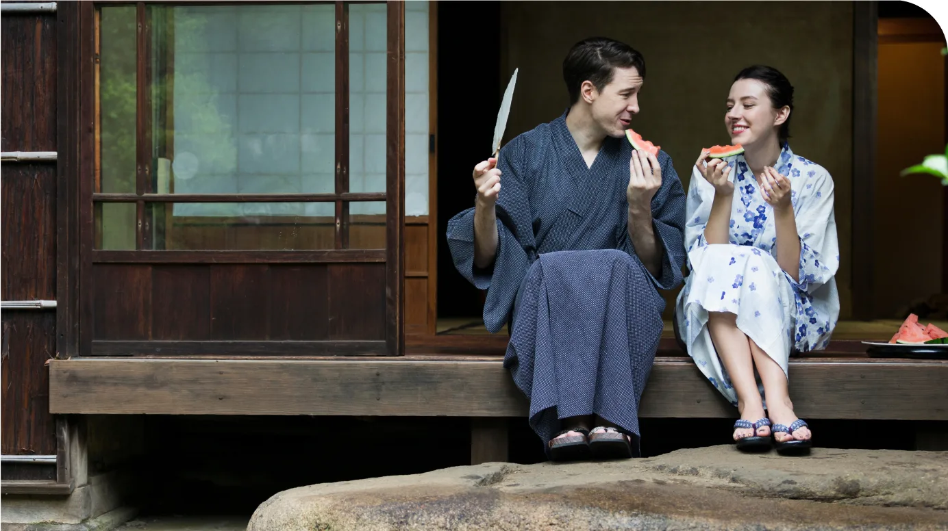 Couple in yukata sitting on a traditional engawa